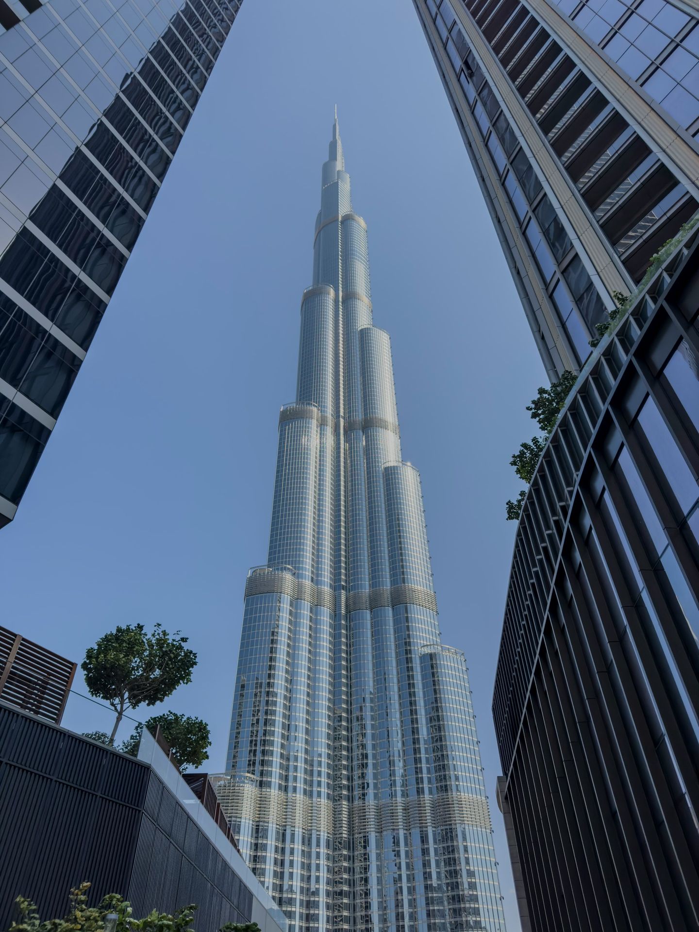 The burj khalifa towers over other buildings.